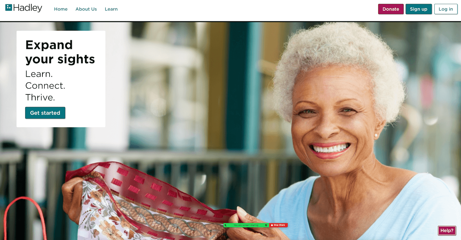 Image Shows senior woman smiling on hadleyhelps.org home page.