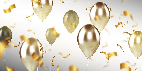 Celebratory golden balloons and confetti.