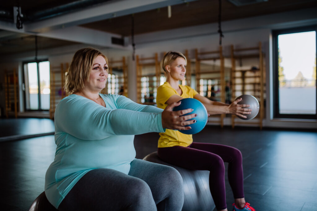 Friends workout together using exercise and 
