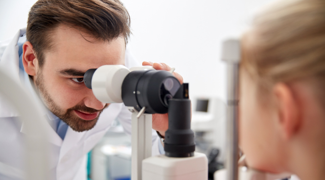 Ophthalmologist examining a patient's eye