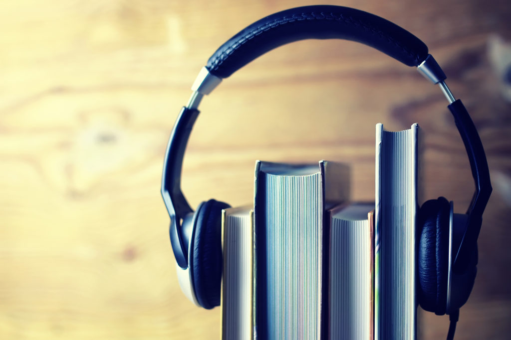 Headphone on a side stack of books.