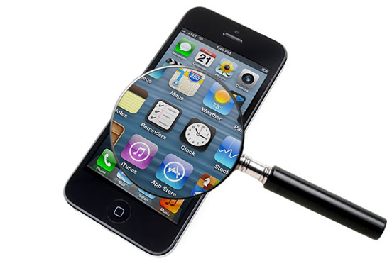 A magnifying glass over an iPhone screen.