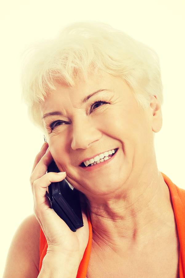 Image shows a grandmother happy and talking on the phone.
