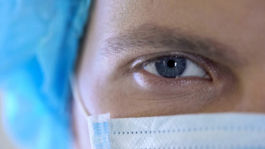 Closeup Image of Doctor's Eyes in a Surgical Mask