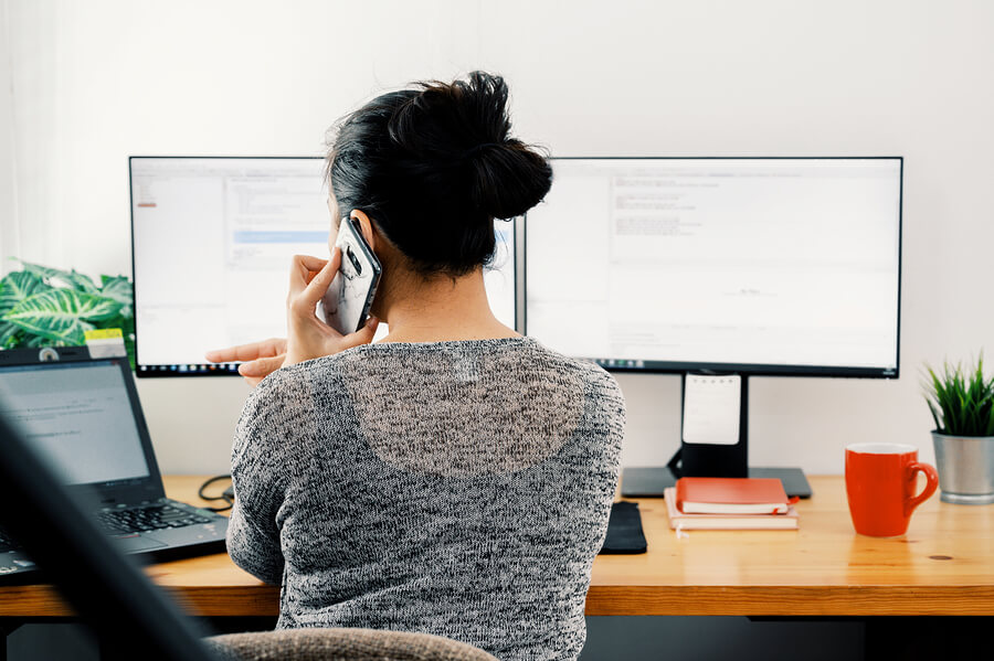 Image of woman working from home on accessible technologies.