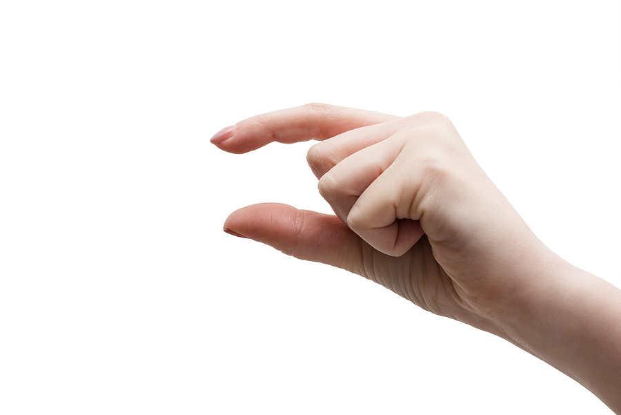Image shows hand making gesture symbolic of small.