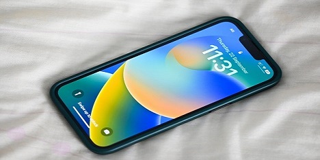iPhone showing iOS 16 logo