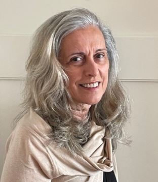 OE Editor, Dorrie Rush looks right toward camera and smiles
