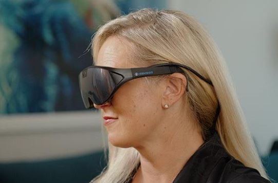 Profile view of woman wearing IrisVision Inspire glasses