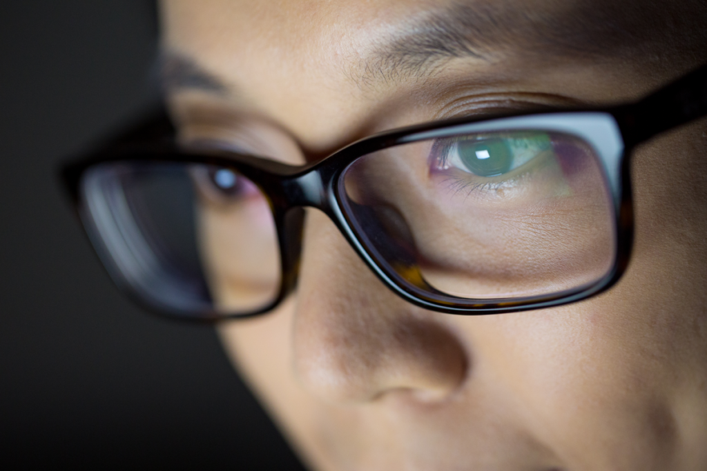Close up of eyes wearing glasses viewing computer screen